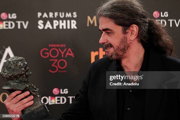 Fernando Leon de Aranoa holds the award for best adapted screenplay award for "Un Dia Perfecto" during The 30th edition of the Goya Awards ceremony...