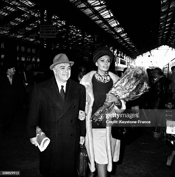 Actress Sophia Loren And Husband Carlo Ponti Arrive At Paris Gare De Lyon To Attend The the Premiere Of the Movie 'Le Couteau Dans La Plaie' - 'Five...