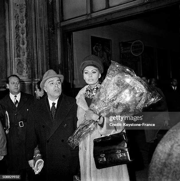 Actress Sophia Loren And Husband Carlo Ponti Arrive At Paris Gare De Lyon To Attend The the Premiere Of the Movie 'Le Couteau Dans La Plaie' - 'Five...