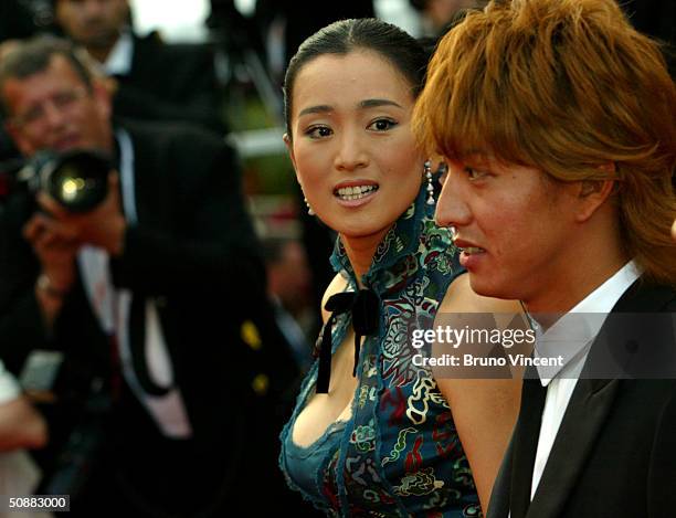 Actress Gongli, wearing Chopard, and actor Takuya Kimura attend "2046" Premiere at Le Palais de Festival at the 57th Cannes Film Festival on May 20,...