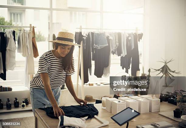 out with the old, in with the new - clothes shop worker stock pictures, royalty-free photos & images