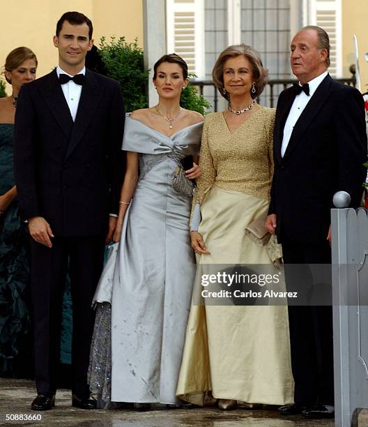 Spanish Crown Prince Felipe de Bourbon and his fiancee, former journalist Letizia Ortiz Rocasolano, pose for a picture with King Juan Carlos and...