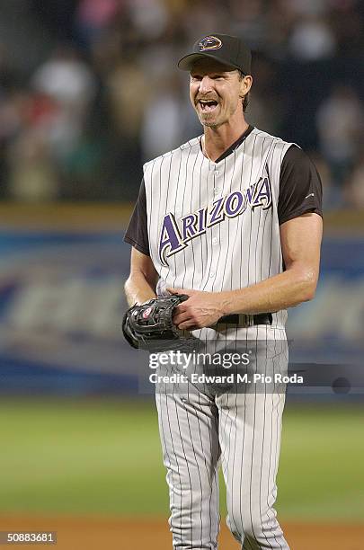 Randy Johnson of the Arizona Diamondbacks smiles after pitching a perfect game against the Atlanta Braves on May 18, 2004 at Turner Field in Atlanta,...