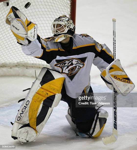 Tomas Vokoun of the Nashville Predators looks to catch the puck with his glove against the Detroit Red Wings in Game five of the first round of the...