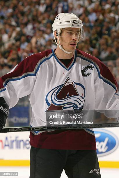 Joe Sakic of the Colorado Avalanche looks on during a break in action against the Dallas Stars in game four of the first round of the 2004 Stanley...