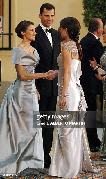 Queen Rania of Jordan congratulates Spanish Crown Prince Felipe of Bourbon and his fiancee Letizia Ortiz prior to an official diner at the Pardo...
