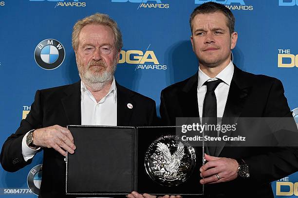 Director Ridley Scott, recipient of the Feature Film Nomination Plaque for The Martian and actor Matt Damon pose in the press room during the 68th...