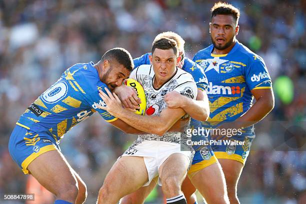 Jonathan Wright of the Warriors is tackled during the final match between the New Zealand Warriors and the Parramatta Eels at the 2016 NRL Auckland...