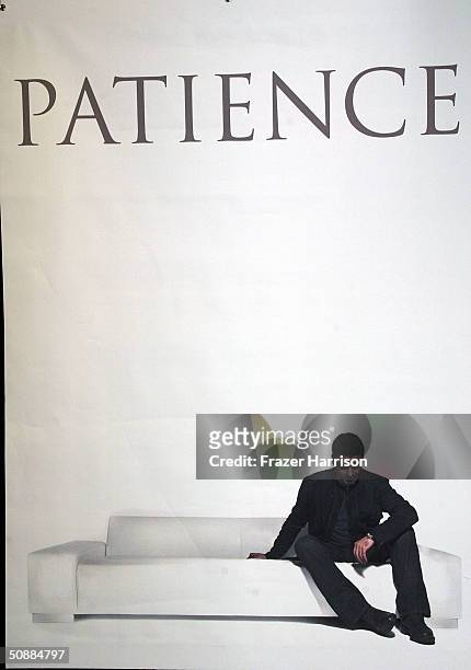Poster of musician George Michael hangs at the Sunset Virgin Megastore where he made an apperance to sign copies of his new CD "Patience" on May 21,...
