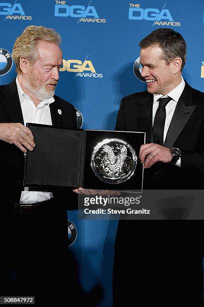 Director Ridley Scott, recipient of the Feature Film Nomination Plaque for The Martian and actor Matt Damon pose in the press room during the 68th...
