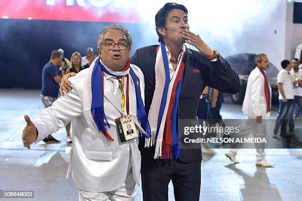 France Consul General Demian Loras is seen with revelers of the Vai-Vai samba school during the second night of the carnival parade at the Sambadrome...