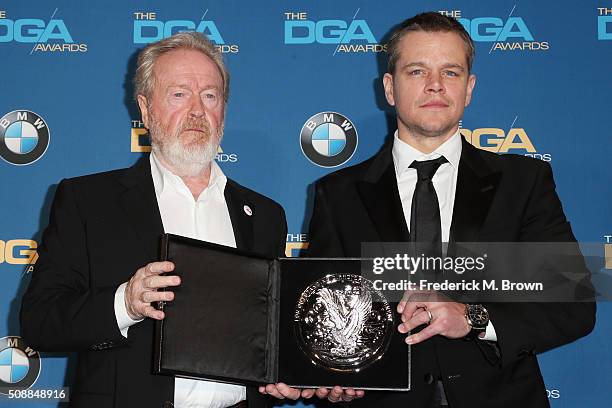 Director Ridley Scott, recipient of the Feature Film Nomination Plaque for The Martian and actor Matt Damon pose in the press room during the 68th...