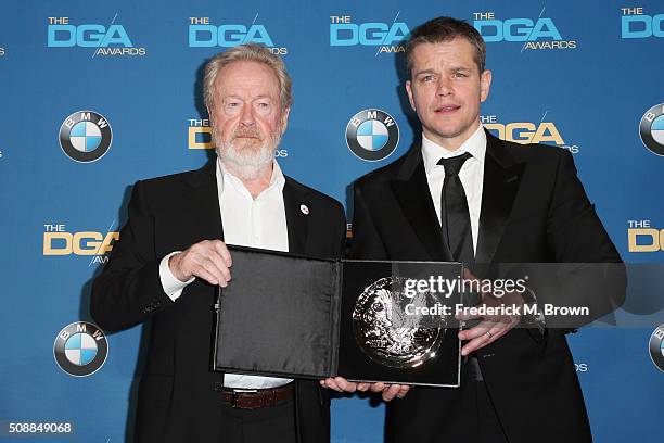 Director Ridley Scott, recipient of the Feature Film Nomination Plaque for The Martian and actor Matt Damon poses in the press room during the 68th...