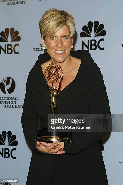 Suze Orman poses with her award for Outstanding Service Show Host backstage at the 31st Annual Daytime Emmy Awards on May 21, 2004 at Radio City...