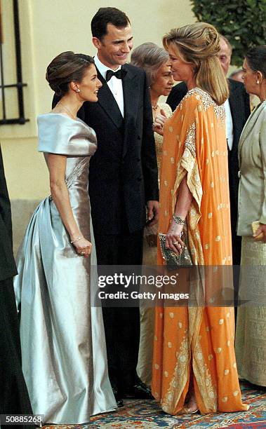 Queen Noor of Jordan greets Spanish Crown Prince Felipe and fiancee Letizia Ortiz Rocasolano as they attend a gala dinner at El Pardo Royal Palace...