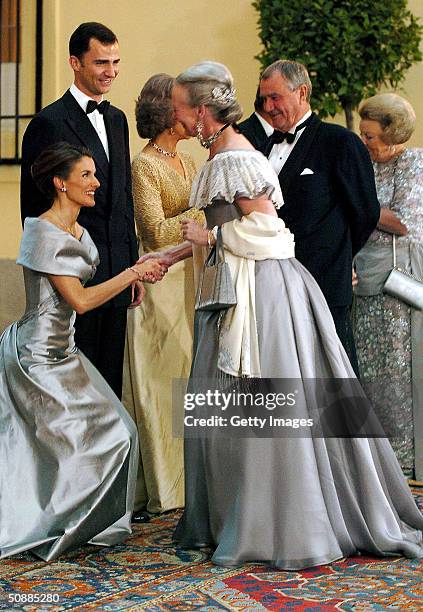 Letizia Ortiz Rocasolano, fiancee of Spanish Crown Prince Felipe, greets Danish Queen Margrethe II during the arrival of a gala dinner at El Pardo...