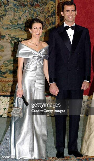 Spanish Crown Prince Felipe and his fiancee Letizia Ortiz Rocasolano pose for a picture as they attend a gala dinner at El Pardo Royal Palace May 21,...
