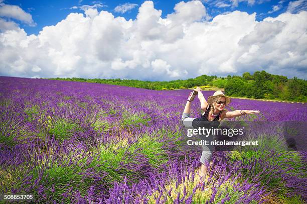 yoga in a lavender field - nicolamargaret stock pictures, royalty-free photos & images