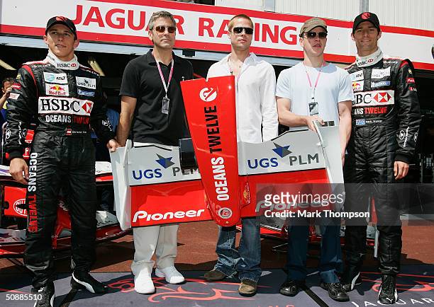 Christian Klien, George Clooney, Brad Pitt, Matt Damon and Mark Webber pose outside the Jaguar garage for a photo-call as the official guests of...