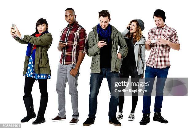 five happy young people busy with cellphones - taking selfie white background stock pictures, royalty-free photos & images