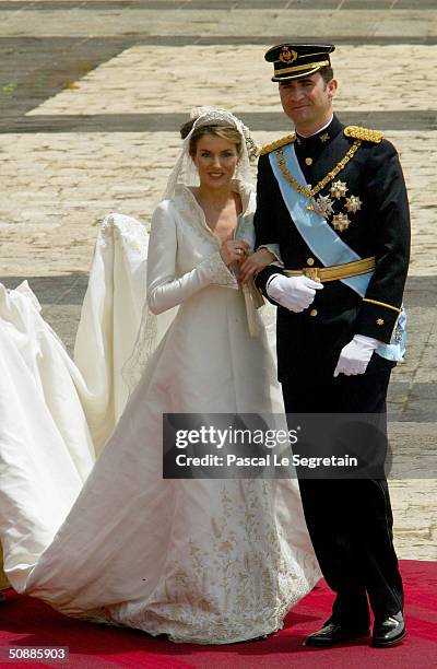 Spanish Crown Prince Felipe de Bourbon and his bride, Princess Letizia Ortiz pose for a picture in the court yard of the royal palace after their...
