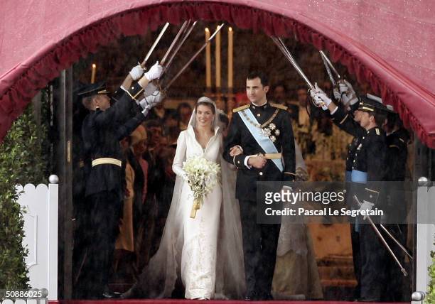 Spanish Crown Prince Felipe de Bourbon and his bride, Princess Letizia Ortiz pose for a picture after their wedding ceremony at the Almudena...