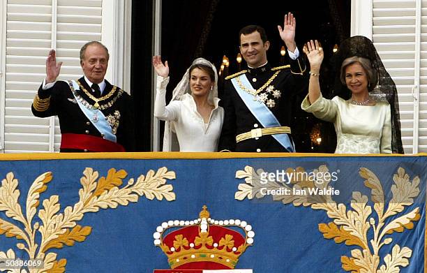 Spanish Crown Prince Felipe de Bourbon and his bride Letizia stand next to Spanish King Juan Carlos , and Queen Sofia as they appear on the balcony...