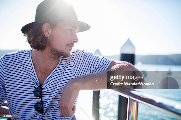 young male hipster on ferry deck sydney harbour - sydney ferry stock pictures, royalty-free photos & images