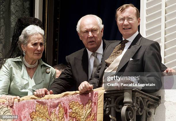 Prince Victor Emmanuel of Savoy stand on the balcony as they watch Spanish Crown Prince Felipe de Bourbon and his wife, princess Letizia Ortiz pose...