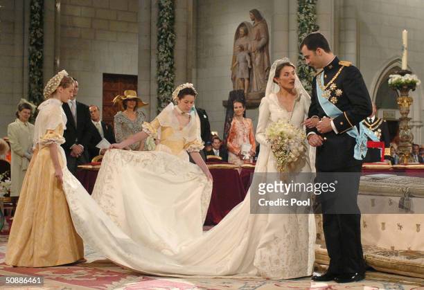 Spain's Crown Prince Felipe de Bourbon stands next to his bride Letizia Ortiz as they marry in Almudena cathedral May 22, 2004 in Madrid.