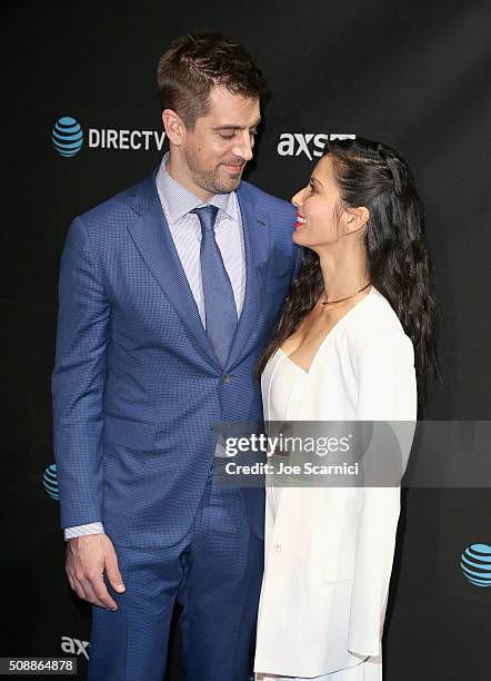 Player Aaron Rodgers and actress Olivia Munn attend the DirecTV and Pepsi Super Saturday Night featuring Red Hot Chili Peppers at Pier 70 on February...