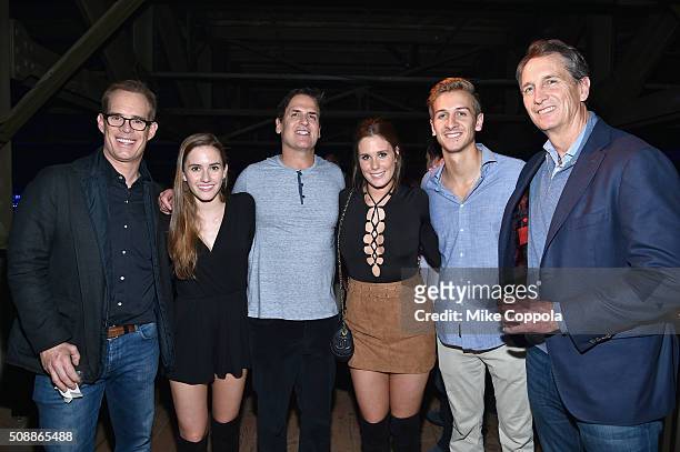 Chairman, CEO and President Mark Cuban poses with TV/radio personality Joe Buck, Trudy Buck, Natalie Buck, Jac Collinsworth and TV...