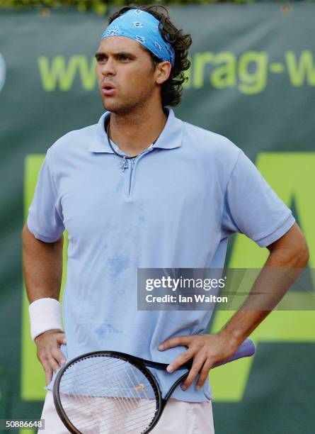Dejected Mark Philippoussis of Australia during his match against Mariano Zabaleta of Chileduring during the ATP 2004 ARAG World Team Cup at the...