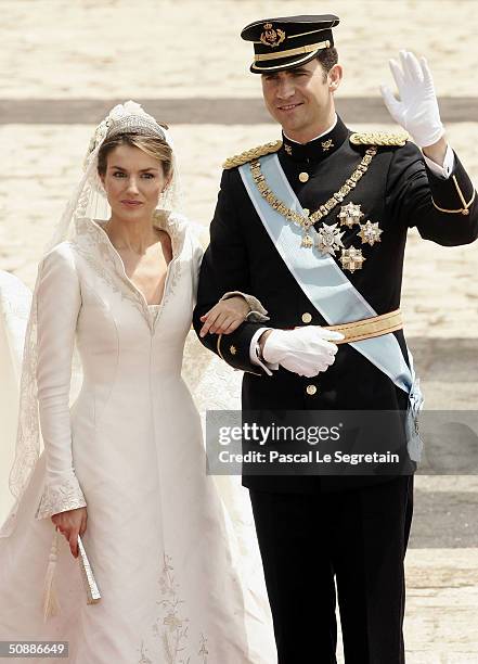 Spanish Crown Prince Felipe de Bourbon and his bride, Princess Letizia Ortiz pose for a picture in the court yard of the royal palace after their...