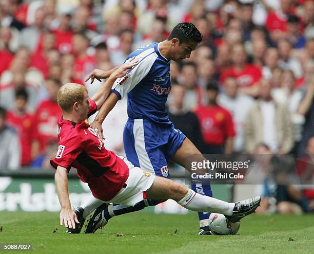 Tim Cahill of Millwall battles with Paul Scholes of Manchester United during the 123rd FA Cup Final between Manchester United and Millwall at The...
