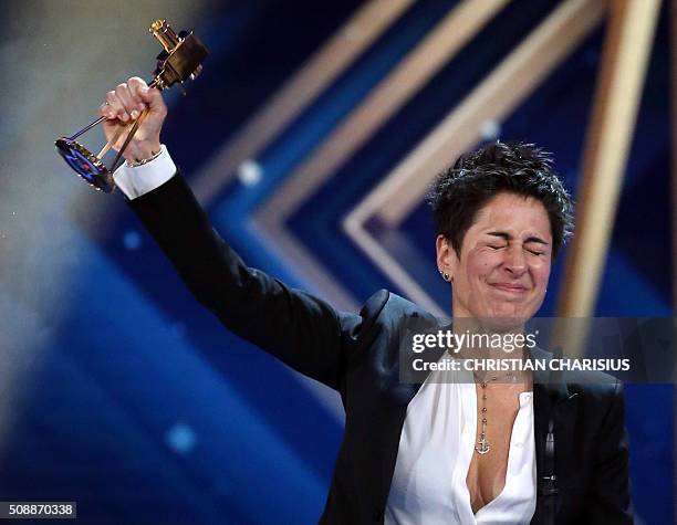 Journalist Dunja Hayali receives the Golden Camera award in Hamburg, northern Germany on February 6, 2016. / AFP / POOL / Christian Charisius