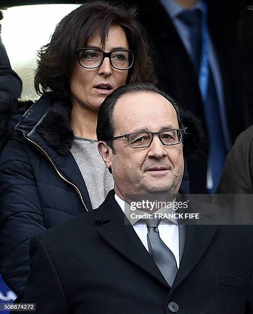 French President Francois Hollande and his councillor for sports Nathalie Iannetta attend the Six Nations international rugby union match between...