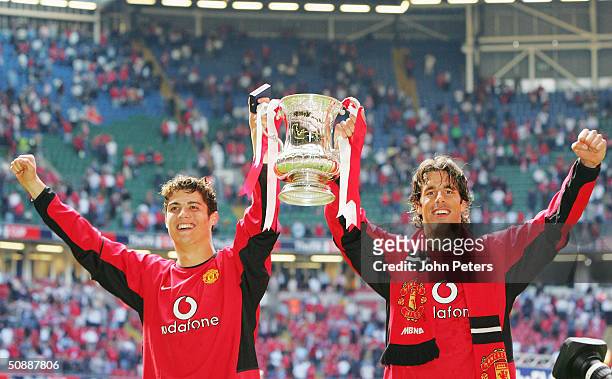 Cristiano Ronaldo and Ruud van Nistelrooy of Manchester United celebrate with the FA Cup after winning the AXA FA Cup Final between Manchester United...