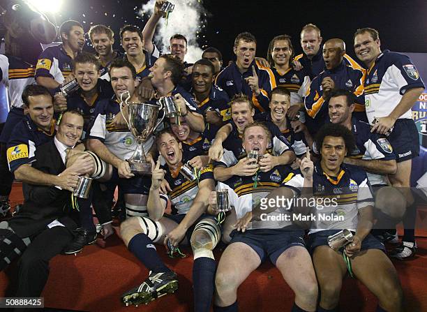Brumbies celebrate winning the Super 12 Rugby Final between the ACT Brumbies and the Crusaders on May 22, 2004 at Canberra Stadium in Canberra,...