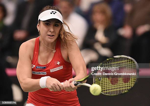 Belinda Bencic of Switzerland plays a backhand in her match against Angelique Kerber of Germany on Day 2 of the 2016 FedCup World Group Round 1 match...