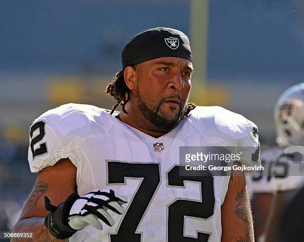 Offensive lineman Donald Penn of the Oakland Raiders looks on from the field before a game against the Pittsburgh Steelers at Heinz Field on November...
