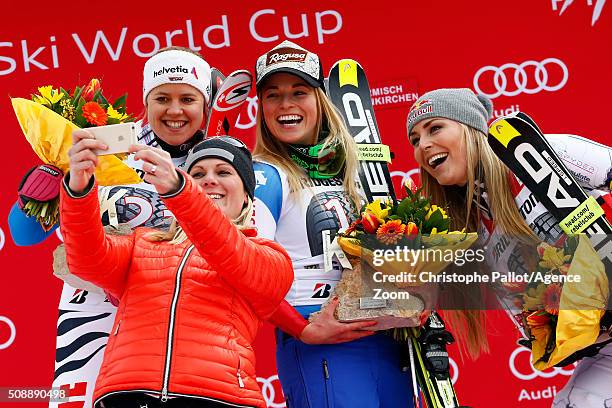 Lara Gut of Switzerland takes 1st place, Viktoria Rebensburg of Germany takes 2nd place, Lindsey Vonn of the USA takes 3rd place and Nicole Hosp of...