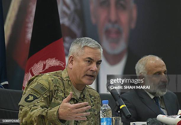 Commander of US and NATO forces in Afghanistan General John F. Campbell speaks during a joint press conference with Afghan Acting Defence Minister...