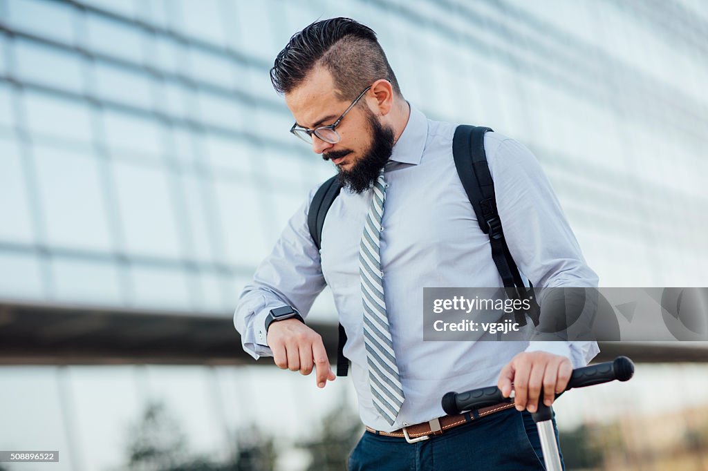Businessman Riding Push Scooter