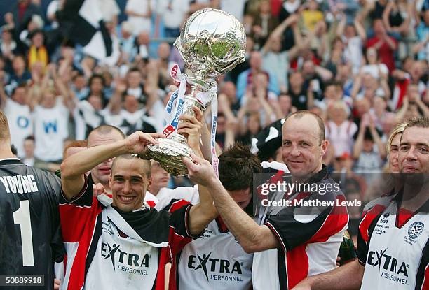 Les Hines and Chris Brindley celebrate winning during the FA Trophy Final match between Canvey Island and Hednesford Town at Villa Park on May 23,...