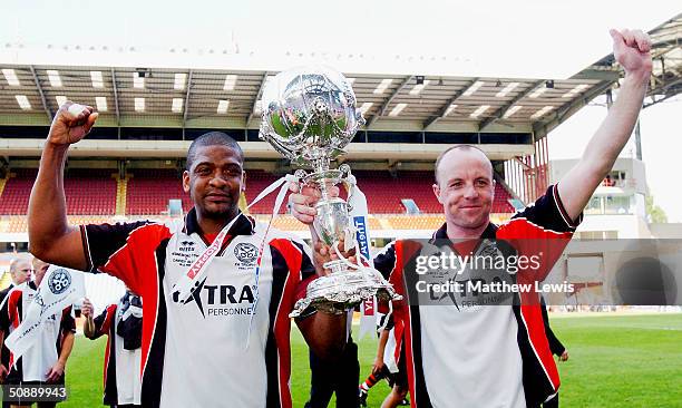 Steve Anthrobus and Chris Brindley of Hendnesford Town celebrate their victory during the FA Trophy Final match between Canvey Island and Hednesford...