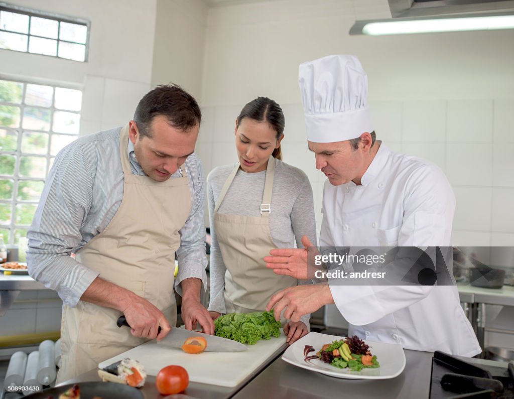 Couple taking a cooking class