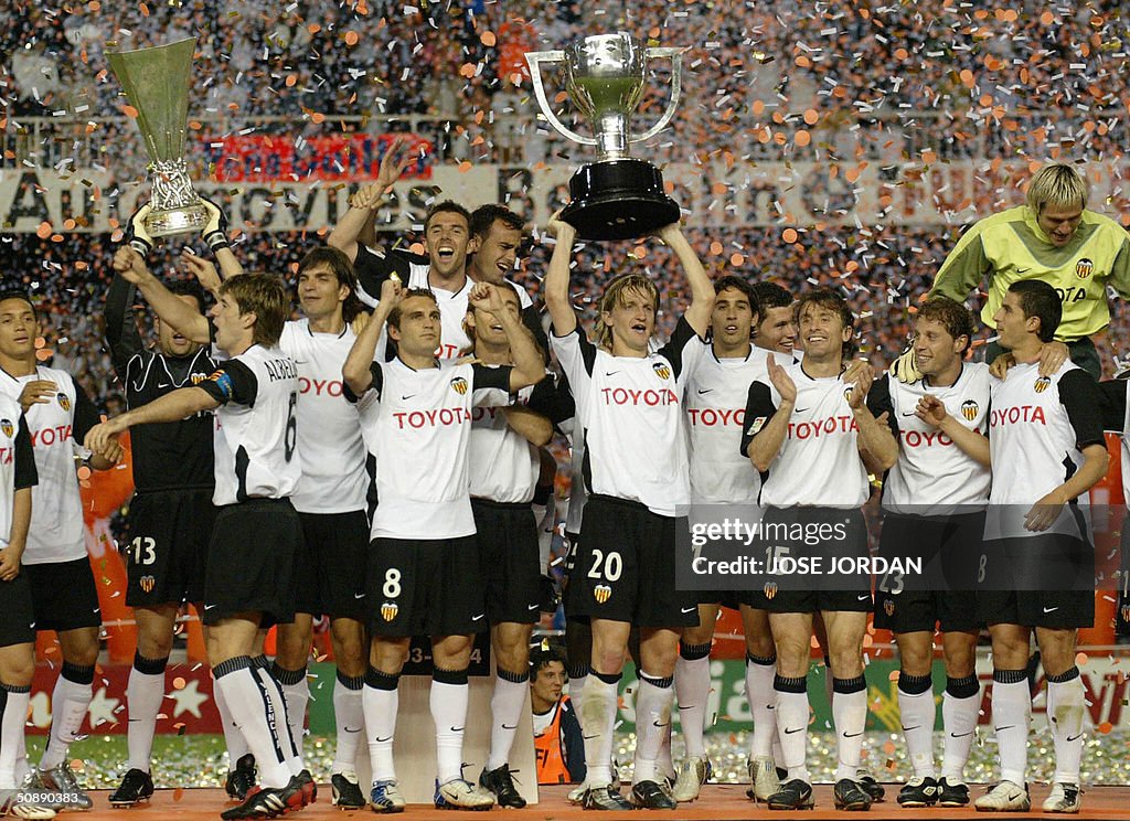 Valencia celebrate with the two cups aft