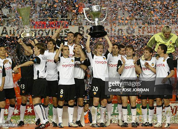 Valencia celebrate with the two cups after winning the Spanish soccer league 2004 title and the UEFA cup Valencia 23 May 2004.