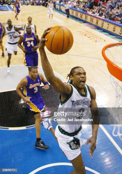 Latrell Sprewell of the Minnesota Timberwolves slam dunks in the first half of Game two of the Western Conference Finals against the Los Angeles...